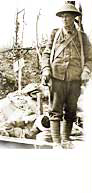 NAC, detail of PA-000518, Taking him out on a stretcher (5th Battalion) WWI soldier, Aug 1916.