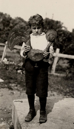 Young Lemelin boy holding a metal weather cock, Saint-Franois, Quebec, 1925., © CMC/MCC, Marius Barbeau, 65769