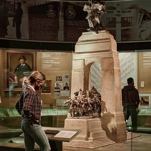 A man is looking at a statue at the Canadian War Museum in Ottawa.