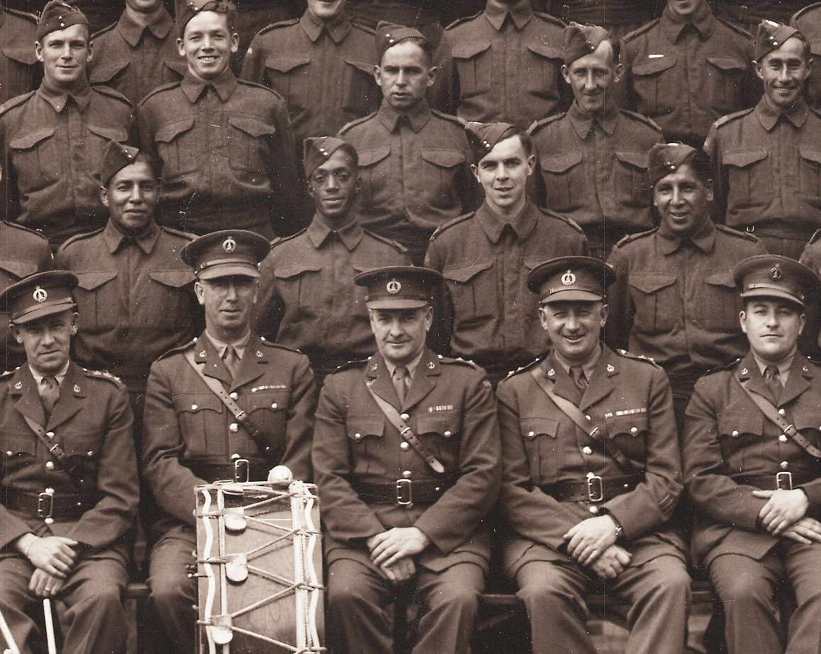 A group of soliders smile at camera